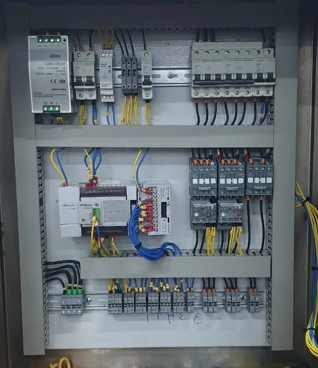 Milk pasteurizer control panel with a Wecon PLC and expansion module, power supply, circuit breakers, contactors and overload relays