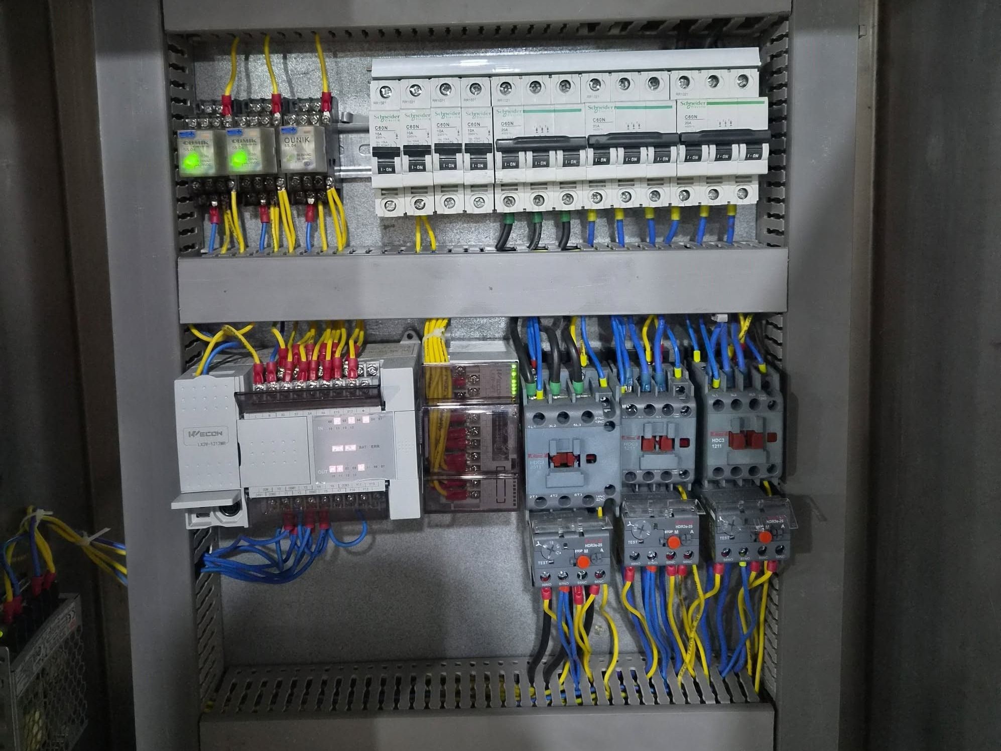 Pasteurizer control panel with Wecon PLC, Schneider Electric circuit breakers, relays, contactors and overload relays